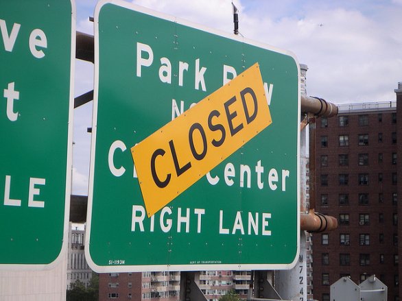 Closed sign over highway exit