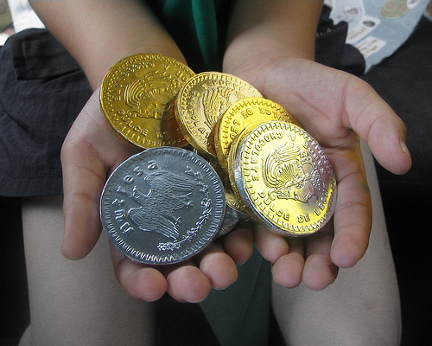 Coins in child\'s hands