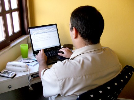 man sending an email